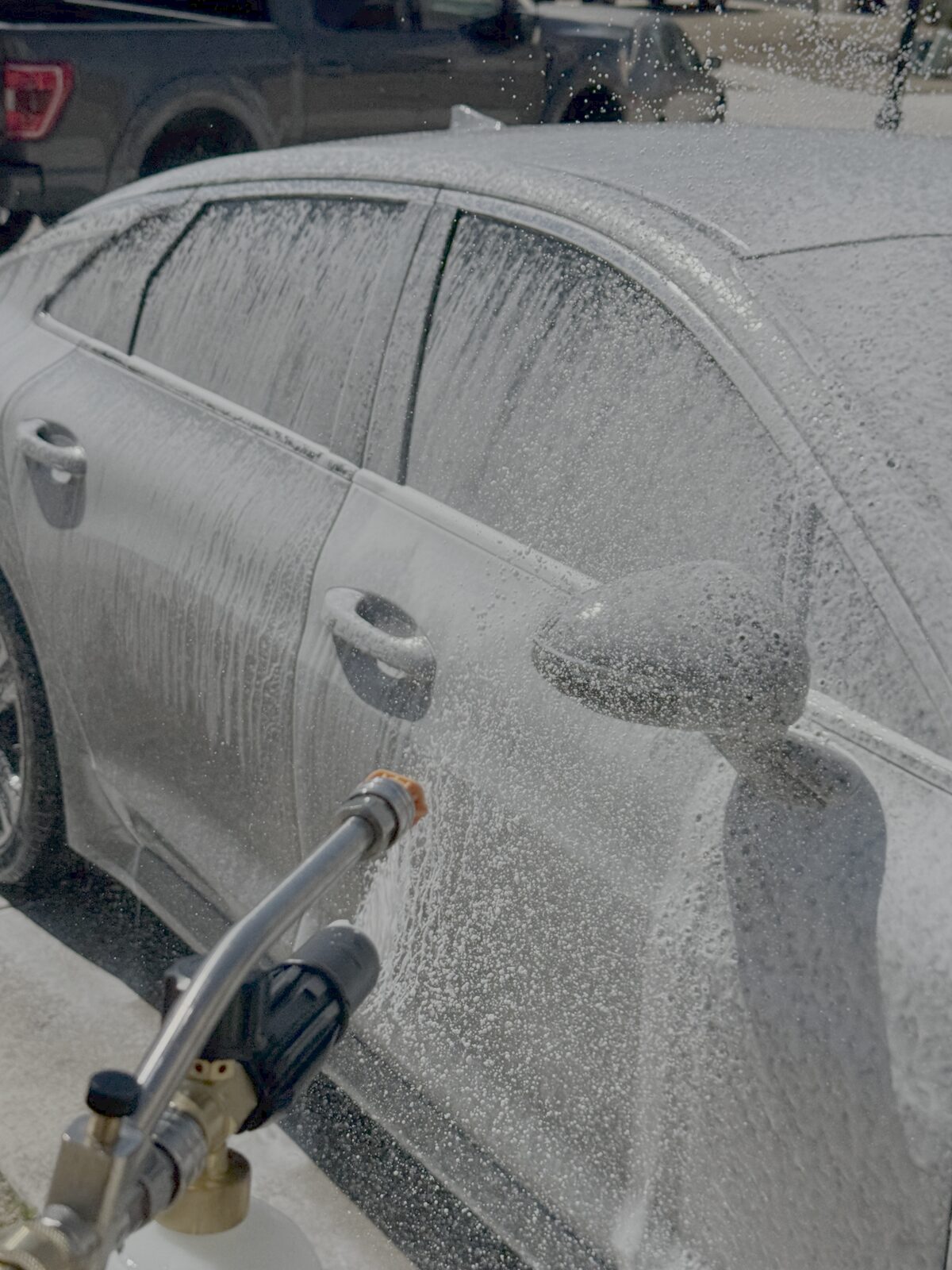 Foam wash on a sedan during a mobile detail