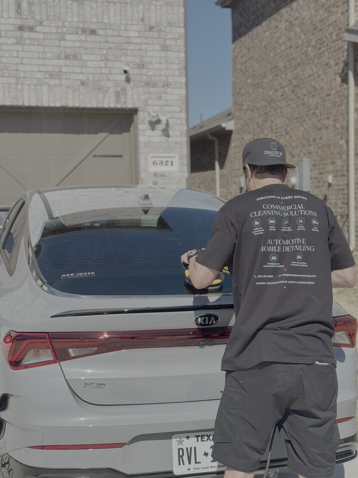 Technician polishing a rear panel
